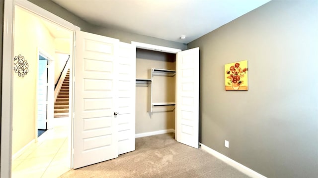 3021 Rocky Point Dr, Pearland, TX 77584 - unfurnished bedroom featuring carpet, a closet, and baseboards