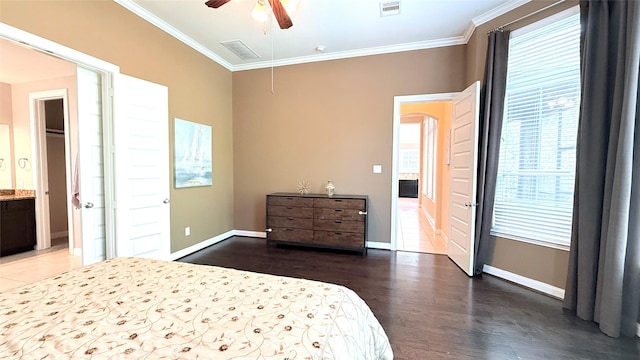 3021 Rocky Point Dr, Pearland, TX 77584 - bedroom featuring ornamental molding, multiple windows, wood finished floors, baseboards, and attic access