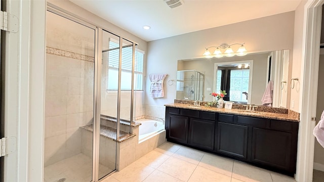 3021 Rocky Point Dr, Pearland, TX 77584 - bathroom featuring a bath, a stall shower, plenty of natural light, and double vanity