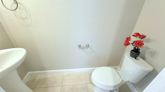 3021 Rocky Point Dr, Pearland, TX 77584 - half bath featuring tile patterned flooring, toilet, and baseboards