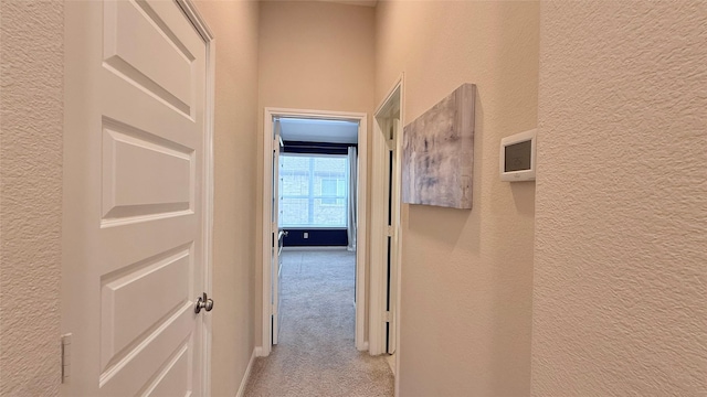 3021 Rocky Point Dr, Pearland, TX 77584 - hallway with a textured wall and light colored carpet
