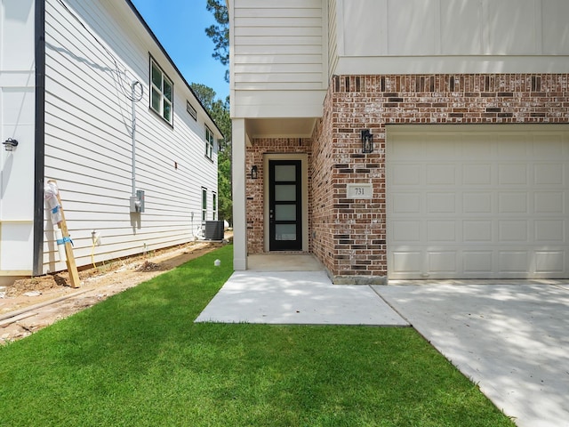 731 Magnolia Point Dr, Houston, TX 77336 - view of exterior entry featuring cooling unit, brick siding, a garage, and a lawn