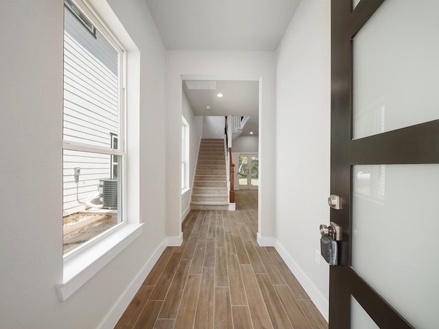 731 Magnolia Point Dr, Houston, TX 77336 - foyer entrance featuring wood finished floors, stairs, and baseboards