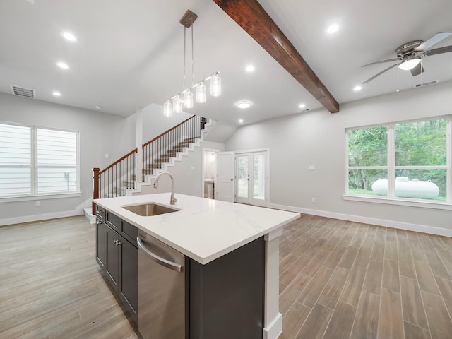 731 Magnolia Point Dr, Houston, TX 77336 - kitchen featuring a sink, stainless steel dishwasher, open floor plan, a ceiling fan, and light wood-style floors