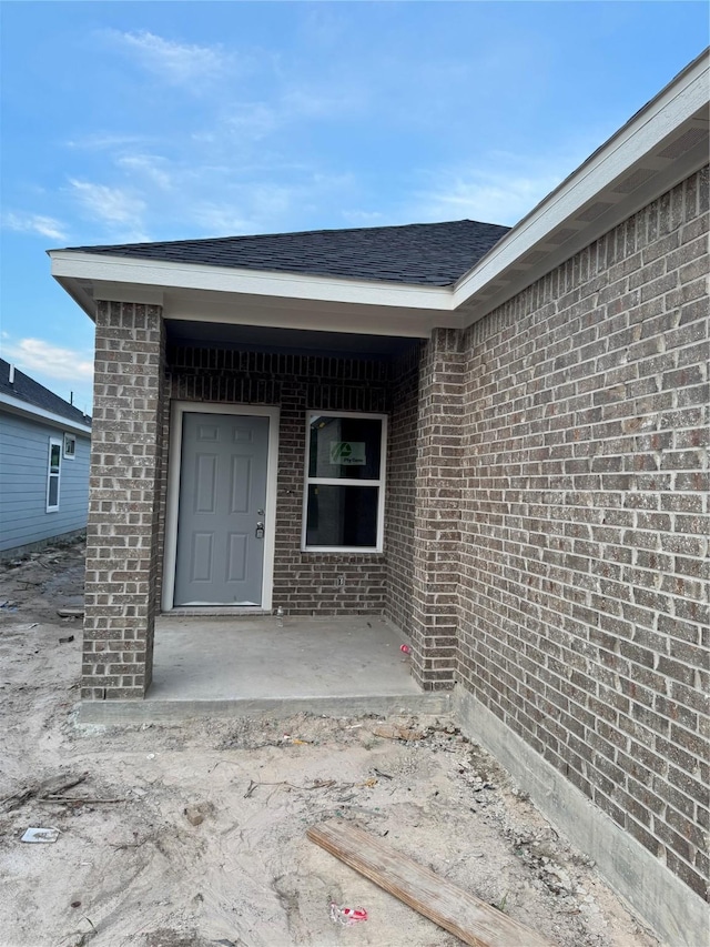 17454 Wigeon Way Dr, Humble, TX 77396 - entrance to property featuring brick siding and roof with shingles