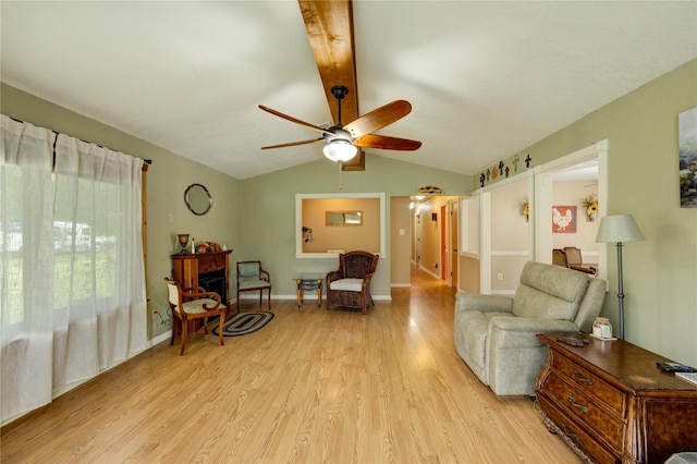 2465 Ryan Dr, Alvin, TX 77511 - living area featuring light wood-style flooring, a ceiling fan, and baseboards