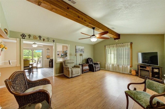 2465 Ryan Dr, Alvin, TX 77511 - living room with ceiling fan, wood finished floors, baseboards, and a textured ceiling