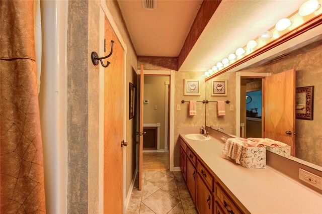 2465 Ryan Dr, Alvin, TX 77511 - full bath featuring double vanity and tile patterned flooring
