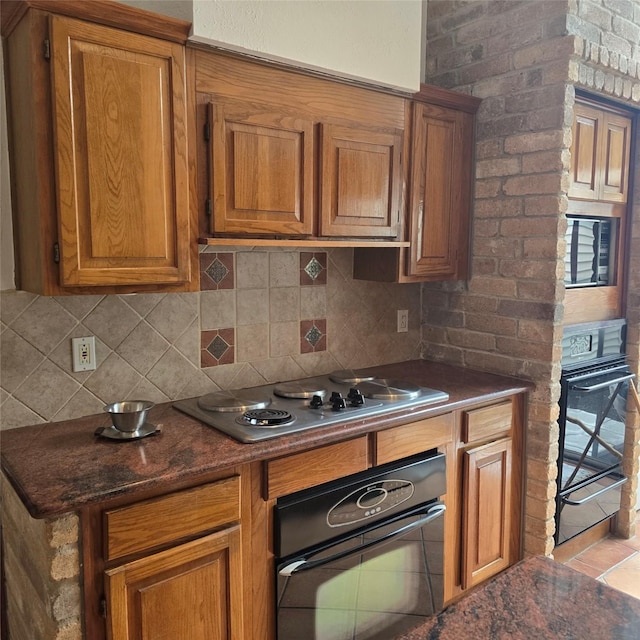 3306 S Greenpark Dr, Houston, TX 77082 - kitchen with wall oven, black oven, brown cabinetry, and decorative backsplash