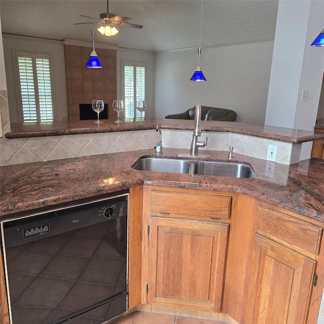 3306 S Greenpark Dr, Houston, TX 77082 - kitchen featuring black dishwasher, a sink, dark stone countertops, ceiling fan, and healthy amount of natural light