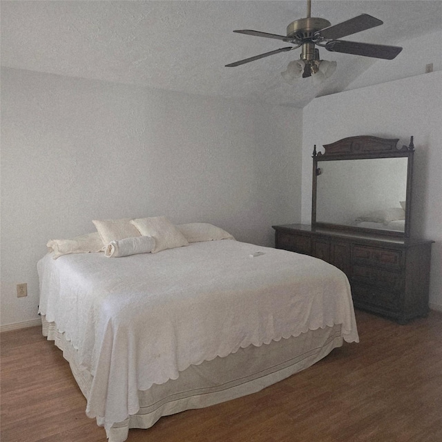 3306 S Greenpark Dr, Houston, TX 77082 - bedroom featuring wood finished floors, lofted ceiling, ceiling fan, and baseboards
