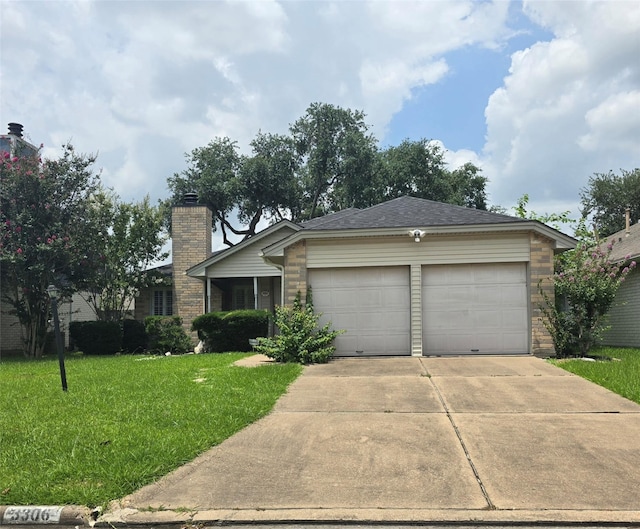 3306 S Greenpark Dr, Houston, TX 77082 - view of front of home featuring a front lawn, a chimney, an attached garage, concrete driveway, and brick siding
