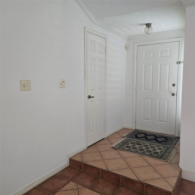 3306 S Greenpark Dr, Houston, TX 77082 - foyer entrance featuring tile patterned floors, ornamental molding, and baseboards