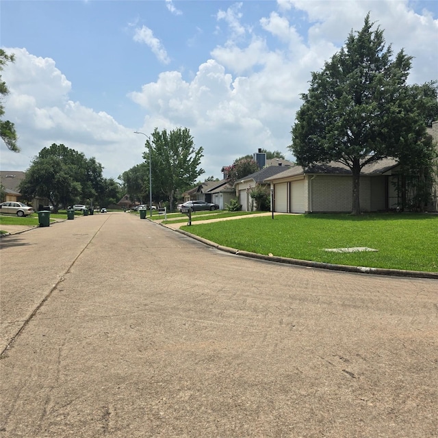 3306 S Greenpark Dr, Houston, TX 77082 - view of concrete road featuring curbs and street lighting