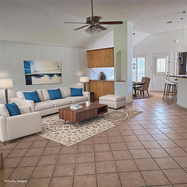 3306 S Greenpark Dr, Houston, TX 77082 - living area with vaulted ceiling, light tile patterned floors, and a ceiling fan