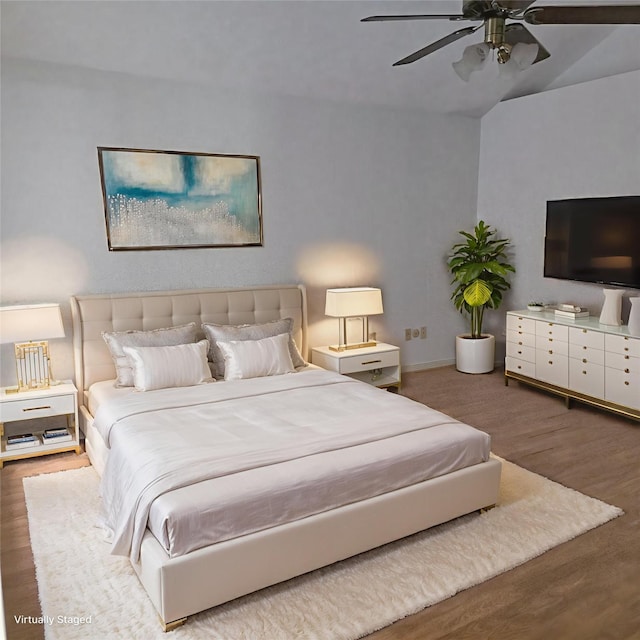 3306 S Greenpark Dr, Houston, TX 77082 - bedroom featuring wood finished floors, vaulted ceiling, and a ceiling fan