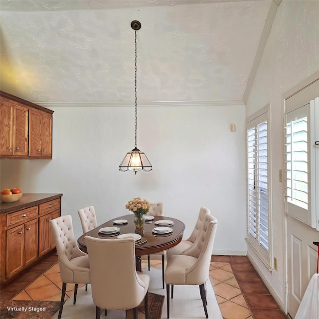 3306 S Greenpark Dr, Houston, TX 77082 - dining area with light tile patterned flooring, vaulted ceiling, and ornamental molding