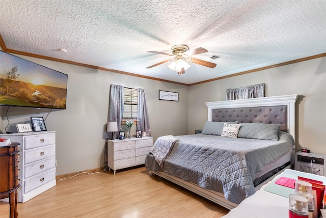 881 County Road 2276, Cleveland, TX 77327 - bedroom with light wood-type flooring, ornamental molding, a textured ceiling, a ceiling fan, and baseboards