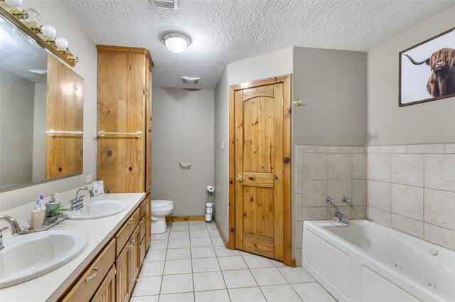 881 County Road 2276, Cleveland, TX 77327 - full bath with double vanity, a garden tub, toilet, tile patterned floors, and a textured ceiling