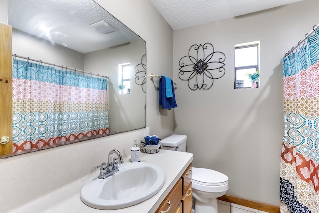 881 County Road 2276, Cleveland, TX 77327 - full bath with toilet, vanity, tile patterned floors, a textured ceiling, and curtained shower