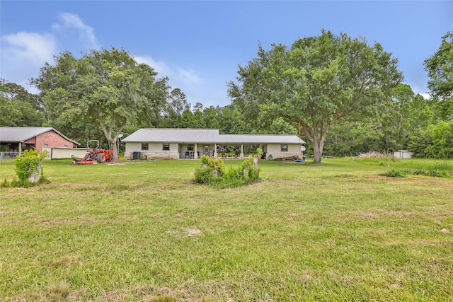 881 County Road 2276, Cleveland, TX 77327 - view of grassy yard