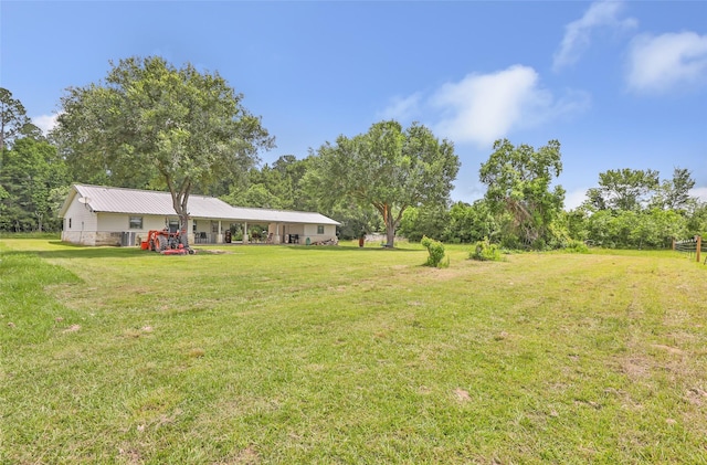 881 County Road 2276, Cleveland, TX 77327 - view of grassy yard featuring view of scattered trees