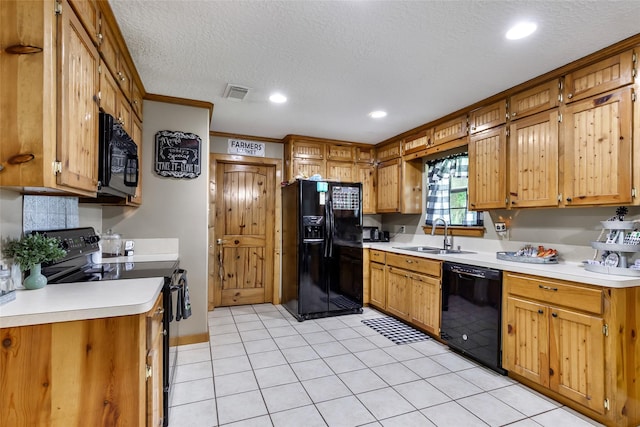881 County Road 2276, Cleveland, TX 77327 - kitchen with black appliances, a sink, a textured ceiling, light countertops, and recessed lighting