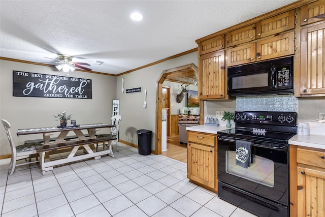 881 County Road 2276, Cleveland, TX 77327 - kitchen with black appliances, light countertops, ornamental molding, a ceiling fan, and a textured ceiling