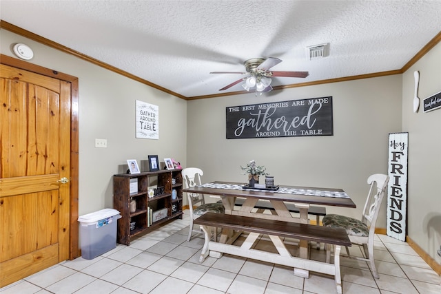 881 County Road 2276, Cleveland, TX 77327 - dining area featuring a ceiling fan, light tile patterned flooring, ornamental molding, and a textured ceiling