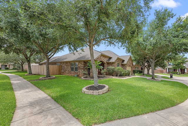 26019 Pagemill Ln, Richmond, TX 77406 - view of front of home featuring a garage, a shingled roof, and brick siding