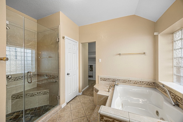26019 Pagemill Ln, Richmond, TX 77406 - bathroom featuring a tub with jets, a stall shower, tile patterned flooring, and vaulted ceiling