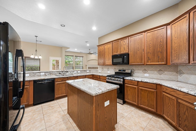 26019 Pagemill Ln, Richmond, TX 77406 - kitchen with black appliances, a sink, brown cabinetry, backsplash, and recessed lighting