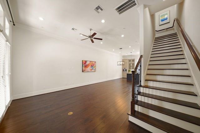 1317 Roy St, Houston, TX 77007 - staircase with ceiling fan, hardwood / wood-style flooring, recessed lighting, baseboards, and crown molding