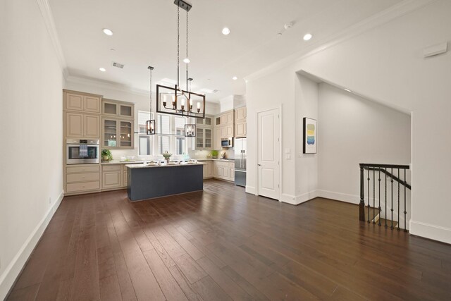 1317 Roy St, Houston, TX 77007 - kitchen featuring cream cabinets, a kitchen island, a chandelier, appliances with stainless steel finishes, and recessed lighting