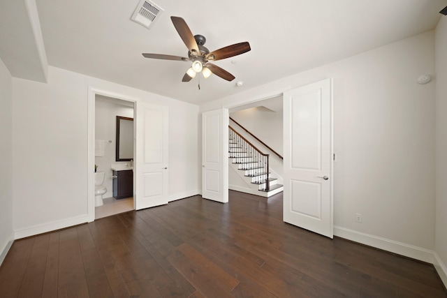 1317 Roy St, Houston, TX 77007 - unfurnished room featuring a ceiling fan, baseboards, and dark wood-style floors