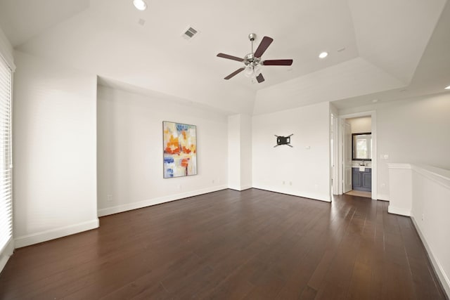 1317 Roy St, Houston, TX 77007 - spare room with a ceiling fan, dark wood-style flooring, recessed lighting, baseboards, and a raised ceiling