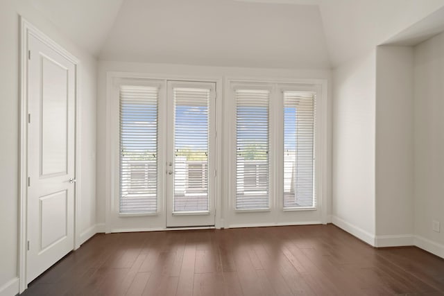 1317 Roy St, Houston, TX 77007 - unfurnished room with lofted ceiling, baseboards, and dark wood-style flooring