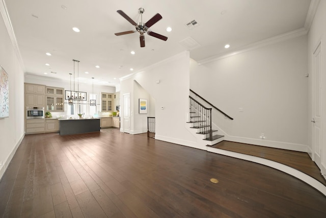 1317 Roy St, Houston, TX 77007 - unfurnished living room featuring crown molding, a ceiling fan, dark wood-type flooring, baseboards, and recessed lighting