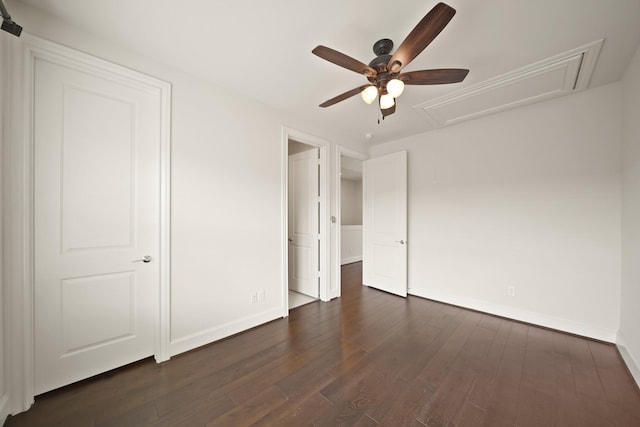 1317 Roy St, Houston, TX 77007 - unfurnished bedroom with attic access, baseboards, dark wood-type flooring, and ceiling fan