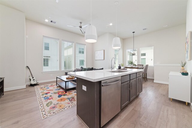 6307 Chelsea Falls Ln, Houston, TX 77008 - kitchen with a sink, dishwasher, light countertops, light wood-style flooring, and recessed lighting