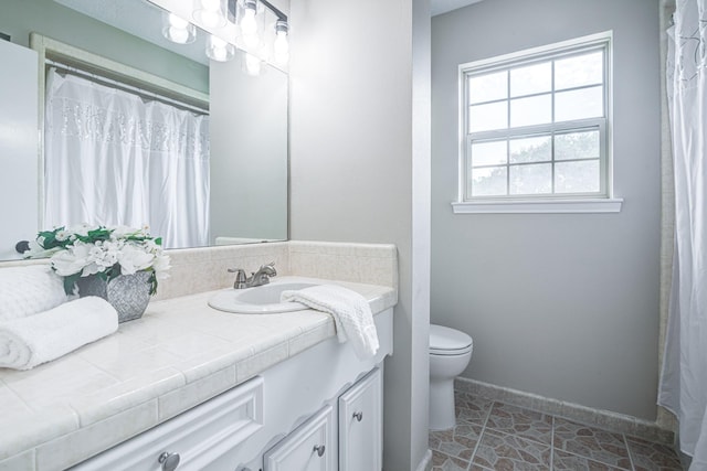 1313 Mcdonald St, Deer Park, TX 77536 - bathroom featuring vanity, toilet, and baseboards