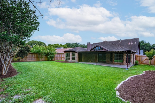 1313 Mcdonald St, Deer Park, TX 77536 - back of house featuring a patio area, a chimney, and brick siding