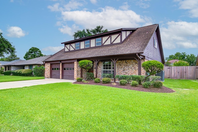 1313 Mcdonald St, Deer Park, TX 77536 - tudor house with concrete driveway, a garage, roof with shingles, and brick siding