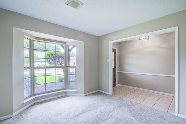 1313 Mcdonald St, Deer Park, TX 77536 - carpeted spare room featuring plenty of natural light and baseboards