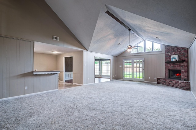 1313 Mcdonald St, Deer Park, TX 77536 - unfurnished living room featuring ceiling fan, lofted ceiling, a fireplace, carpet, and baseboards