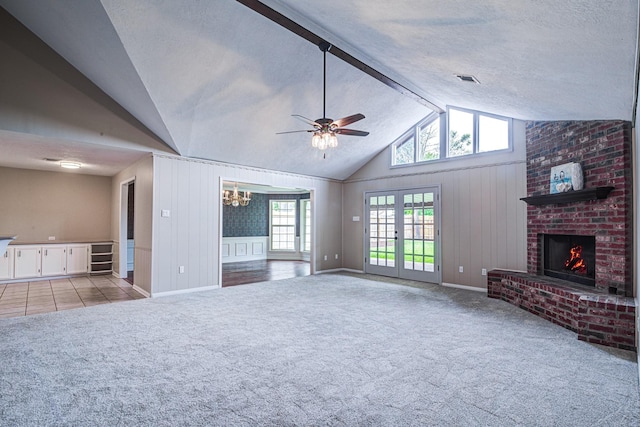 1313 Mcdonald St, Deer Park, TX 77536 - unfurnished living room featuring a brick fireplace, carpet floors, lofted ceiling, a ceiling fan, and a chandelier