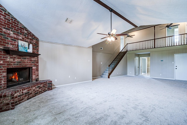 1313 Mcdonald St, Deer Park, TX 77536 - unfurnished living room with a ceiling fan, a fireplace, carpet, baseboards, and stairway