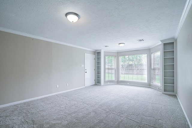 1313 Mcdonald St, Deer Park, TX 77536 - carpeted spare room with ornamental molding, baseboards, and a textured ceiling