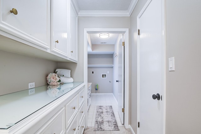 1313 Mcdonald St, Deer Park, TX 77536 - washroom with washer hookup, electric dryer hookup, cabinet space, crown molding, and light tile patterned floors