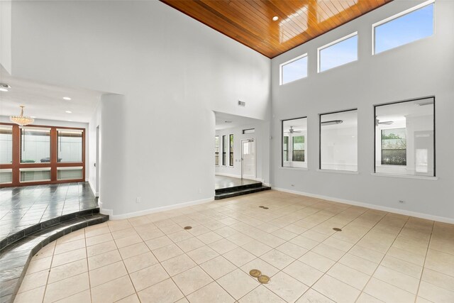 12203 Ashley Circle Dr E, Houston, TX 77071 - empty room with wooden ceiling, high vaulted ceiling, light tile patterned floors, a chandelier, and recessed lighting